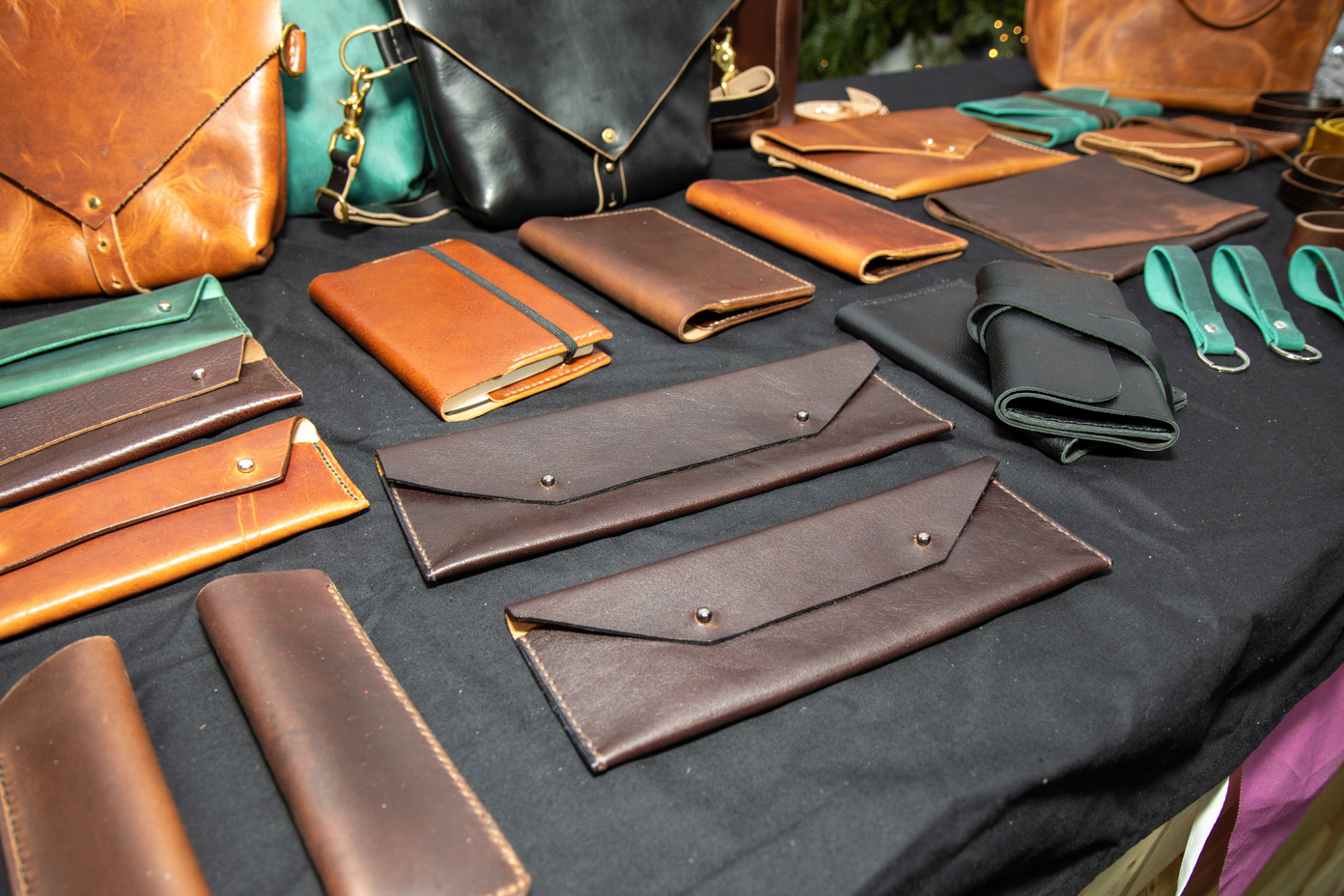 A selection of leather wallets and other leather goods on a table
